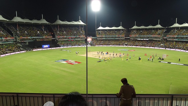 A professional Cricket Loft: Elevate Your Game to New Heights Loft: Elevate Your Game to New Heights stadium bathed in floodlights, ready for a major match, symbolizing grand achievements.